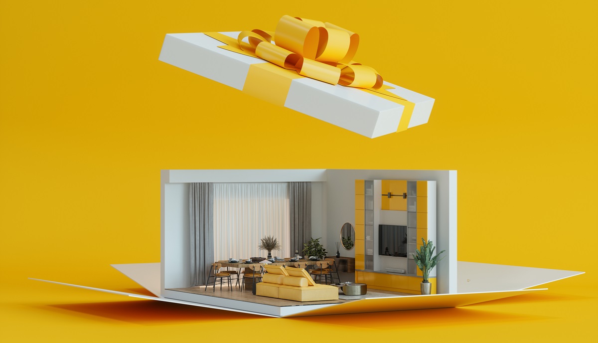 white and yellow gift box with house replica inside