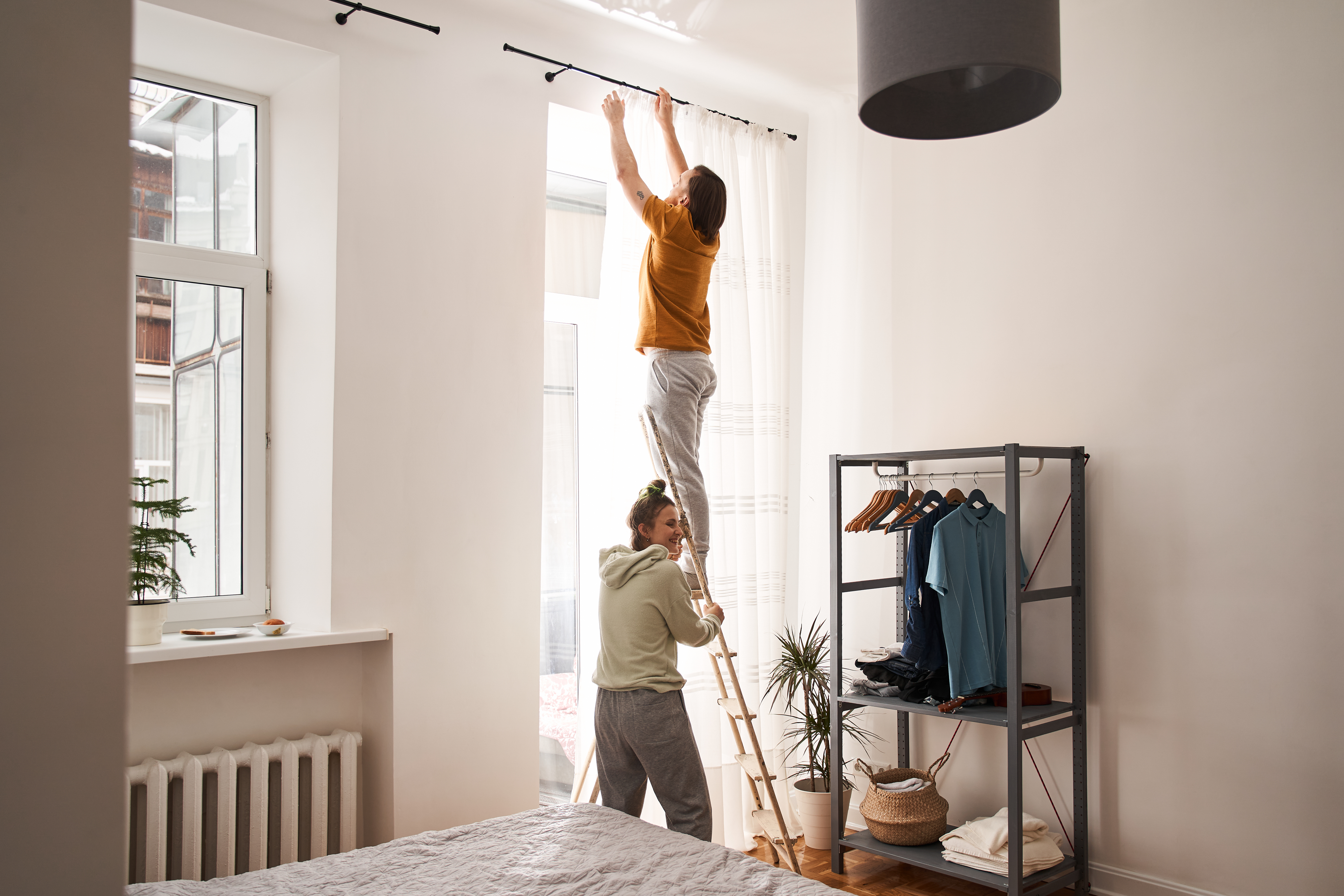 man and woman on a ladder, RRSP savings for Canadian lawyers