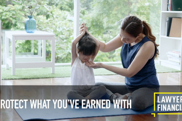 Mother and daughter practicing yoga