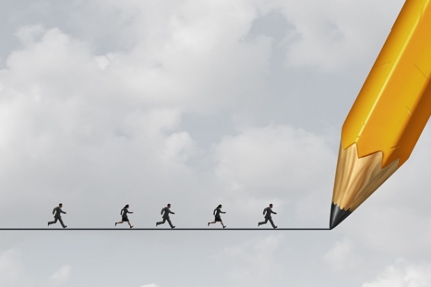 Yellow pencil drawing a line in the sky